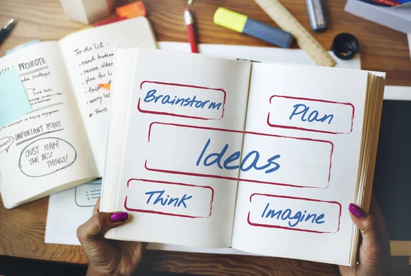 Woman holding diary — Stock Photo, Image