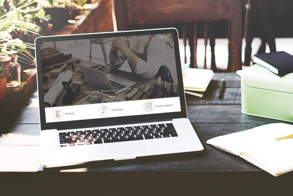 Laptop on wooden table — Stock Photo, Image