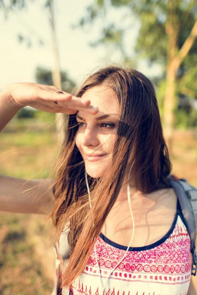 Woman listening music in earphones Stock Picture