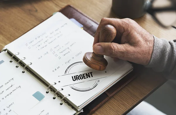 Man putting stamp on paper notebook — Stock Photo, Image