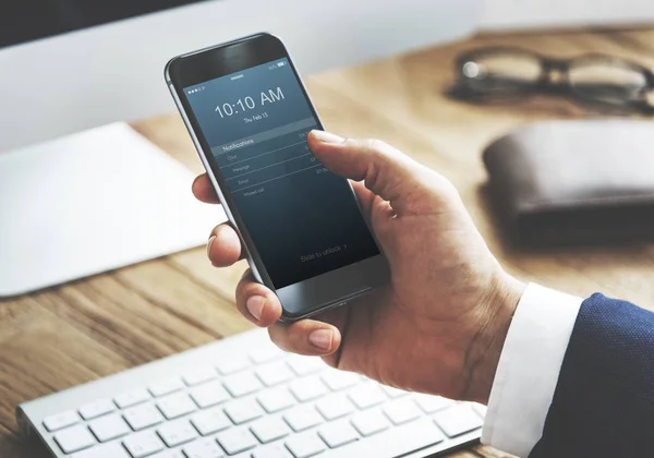 Businessman browsing mobile phone — Stock Photo, Image