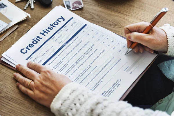 Woman writing in application paper — Stock Photo, Image