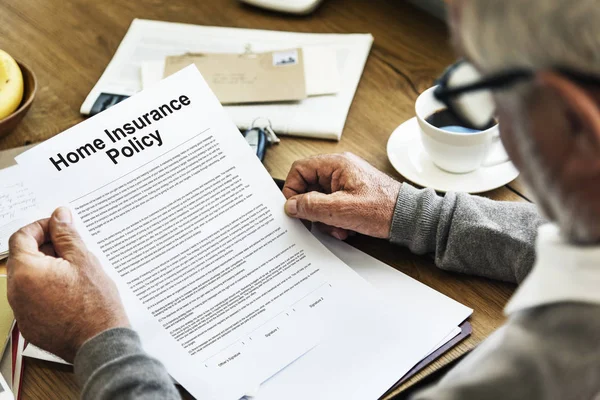 Senior Man holding paper document — Stock Photo, Image