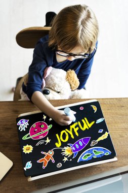 Little Girl drawing on Blackboard clipart