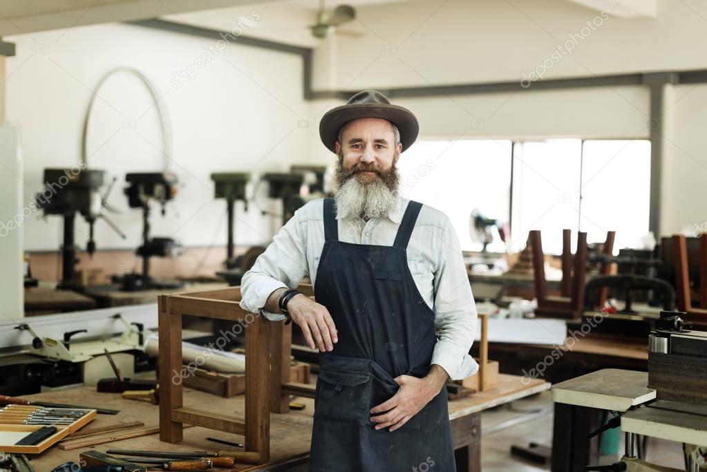 handsome Craftsman in workshop studio