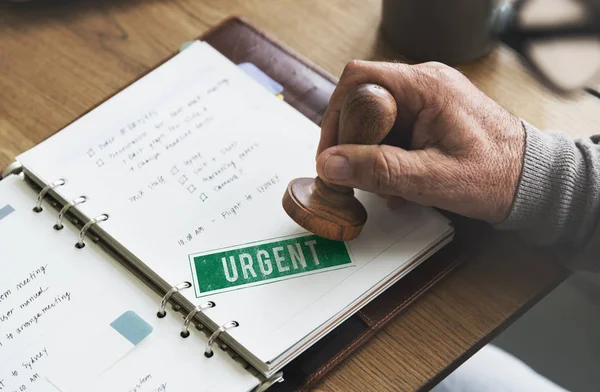 Man putting stamp on paper notebook — Stock Photo, Image