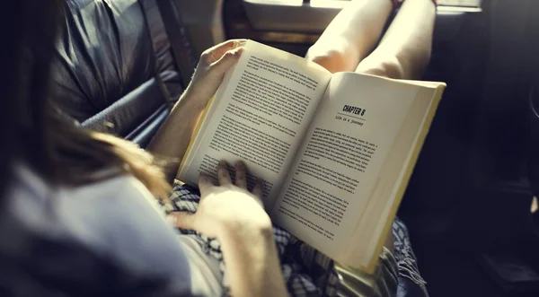 Girl Reading Book  in car — Stock Photo, Image