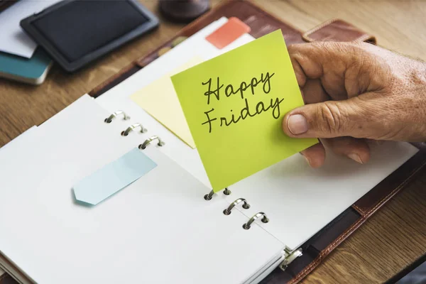 Person holding yellow stick note — Stock Photo, Image