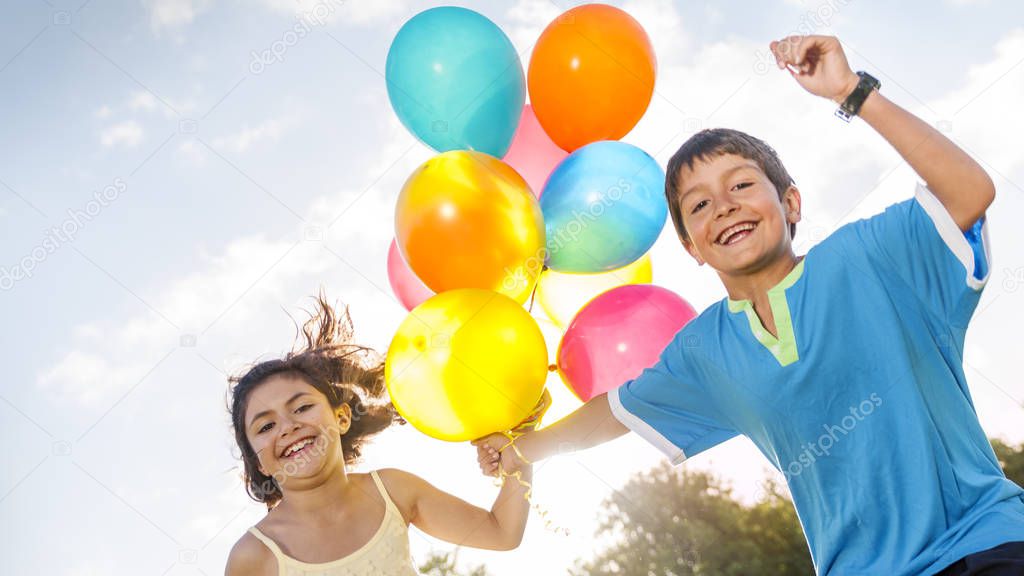 Children playing with Balloons