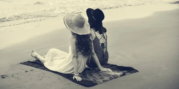 Beautiful women chilling near ocean — Stock Photo, Image