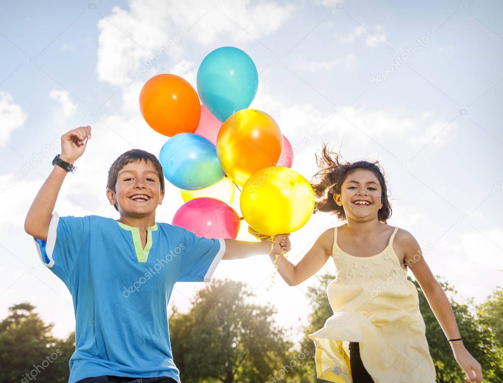 Children playing with Balloons