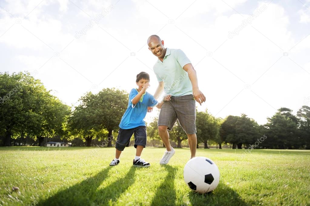 Father with son play Football 