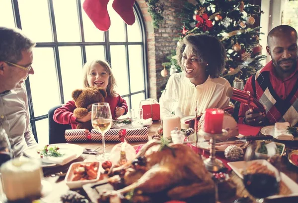 Family at table with a festive dinner — Stock Photo, Image