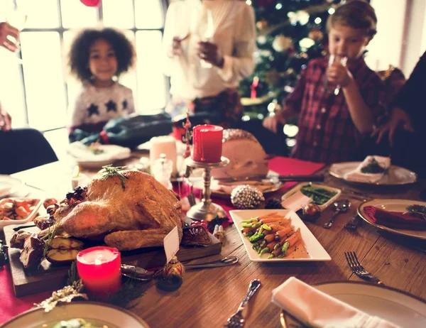 Family at table with a festive dinner — Stock Photo, Image