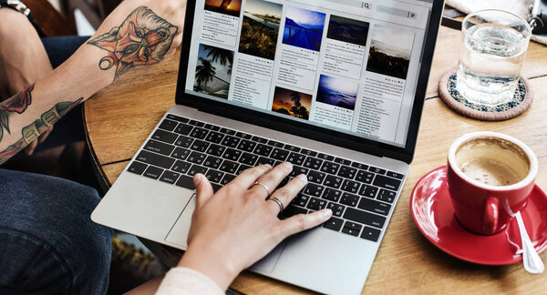 woman Browsing Internet On Laptop