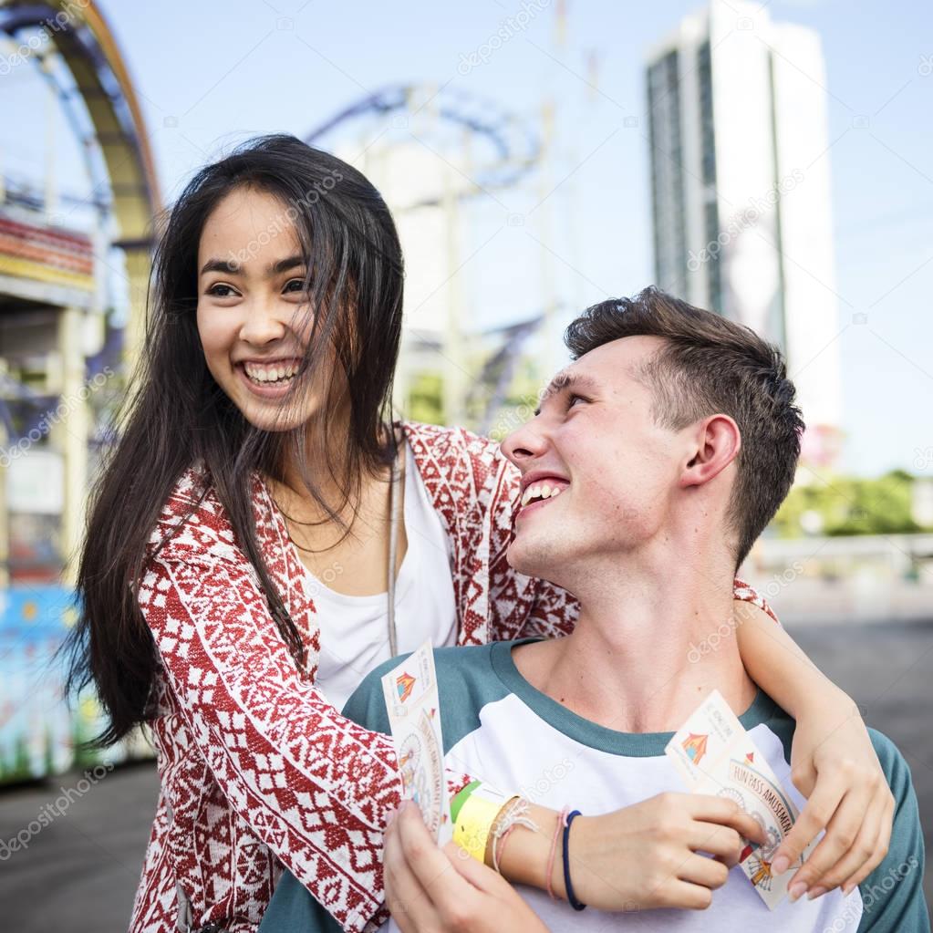 beautiful couple dating in amusement park