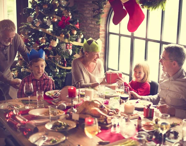 Family at table with a festive dinner — Stock Photo, Image