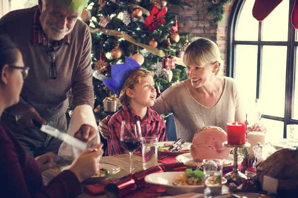 Family at table with a festive dinner — Stock Photo, Image