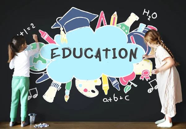 Kids drawing on blackboard — Stock Photo, Image