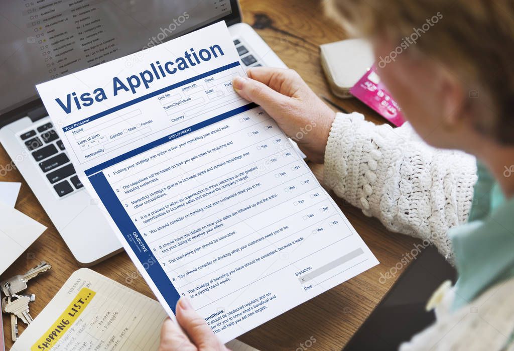 senior woman with application form