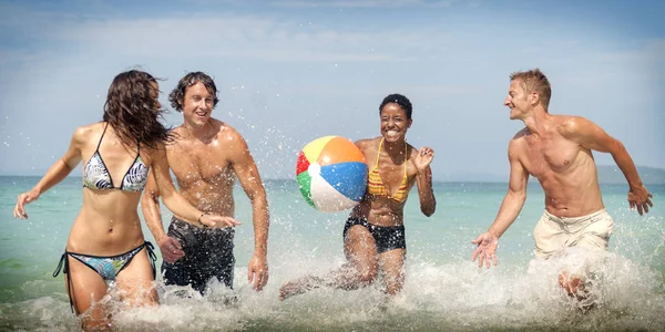 People playing with ball on beach — Stock Photo, Image