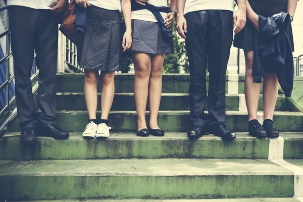 Olika studenter i College Uniform — Stockfoto