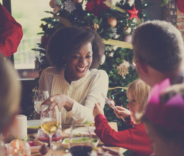 Family at table with a festive dinner — Stock Photo, Image