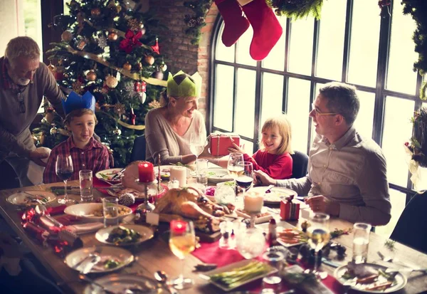 Family at table with a festive dinner — Stock Photo, Image