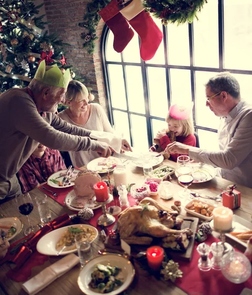 Family at table with a festive dinner — Stock Photo, Image