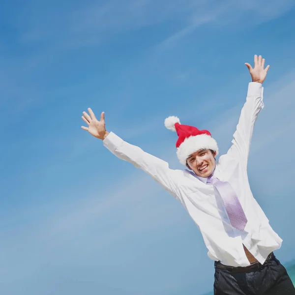 Podnikatel nosit klobouk santa — Stock fotografie