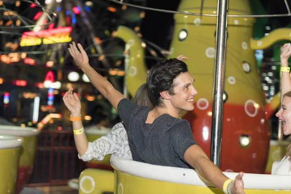 Friends riding bumper car — Stock Photo, Image