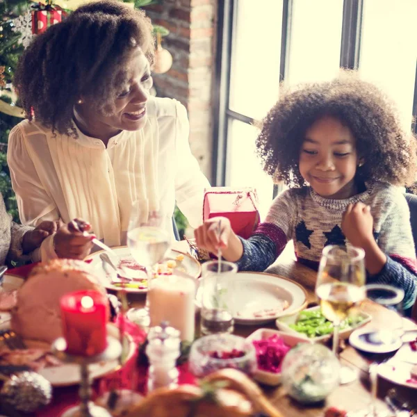 Family at table with a festive dinner — Stock Photo, Image