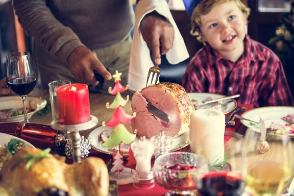 Family at table with a festive dinner — Stock Photo, Image