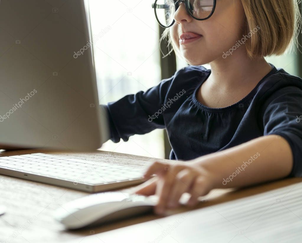 little girl using computer