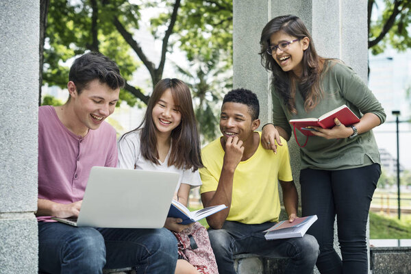 Young Diverse friends Studying Outdoors