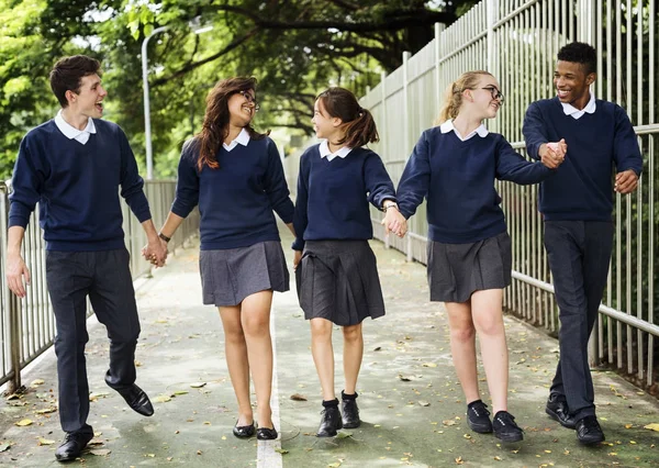 Olika studenter i College Uniform — Stockfoto