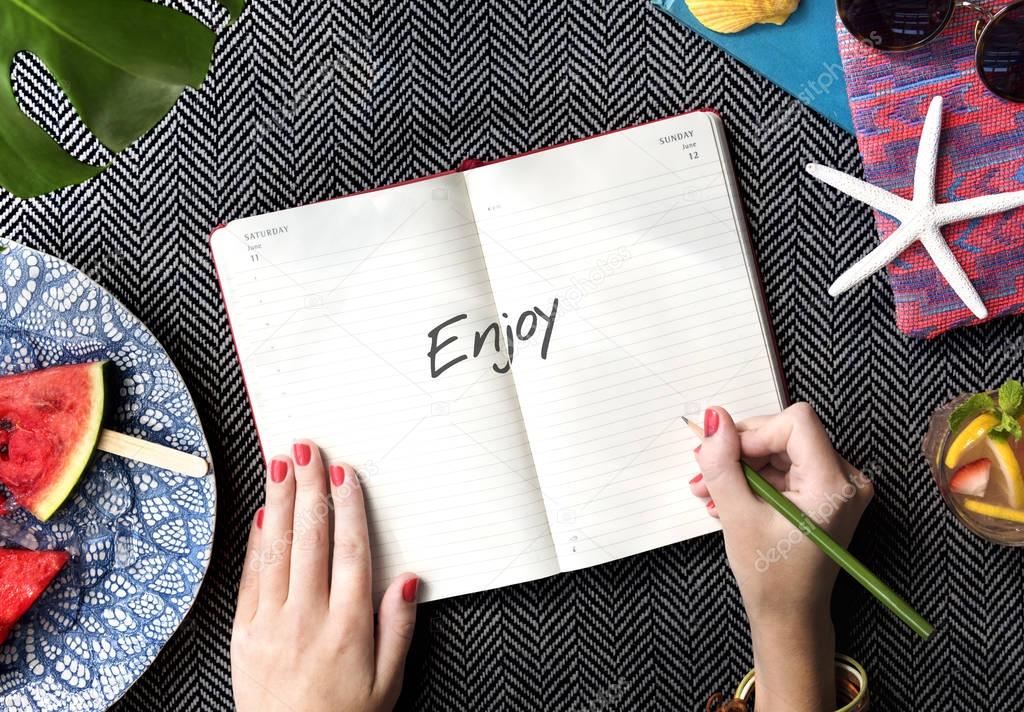 Woman writing notes in diary