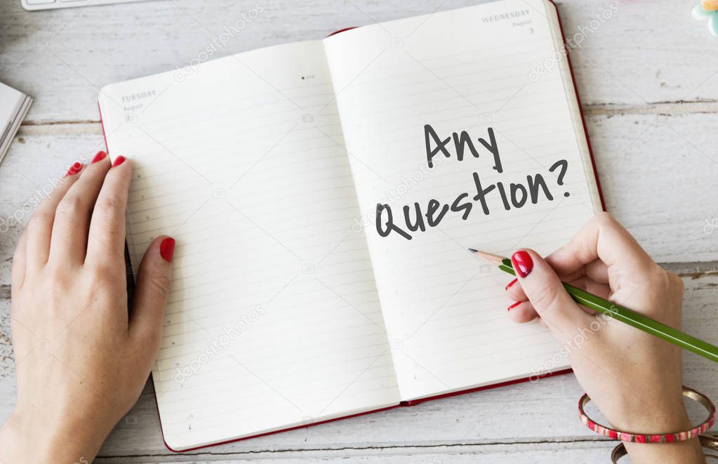 Woman writing notes in diary