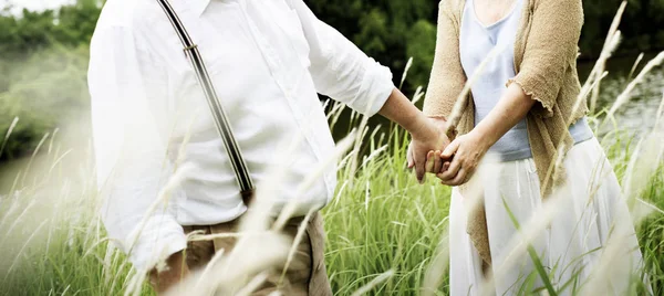 Elderly Couple in Love holding hands — Stock Photo, Image