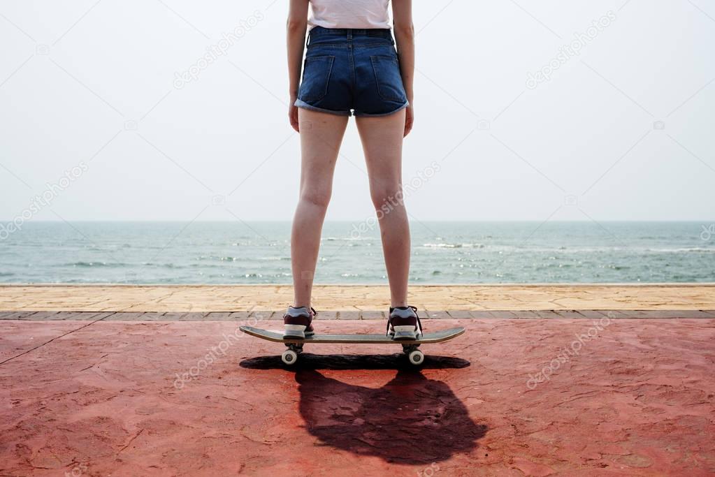 girl in shorts riding Skateboard