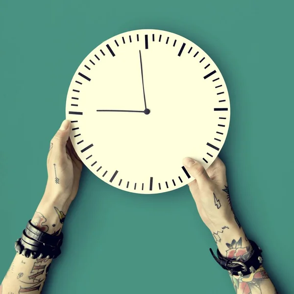 Hands in tattoos with clock — Stock Photo, Image