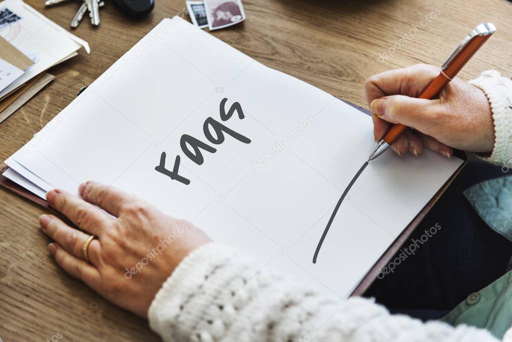 person writing on paper