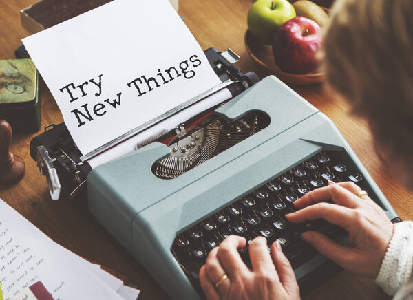 senior woman writing on typewriter machine 