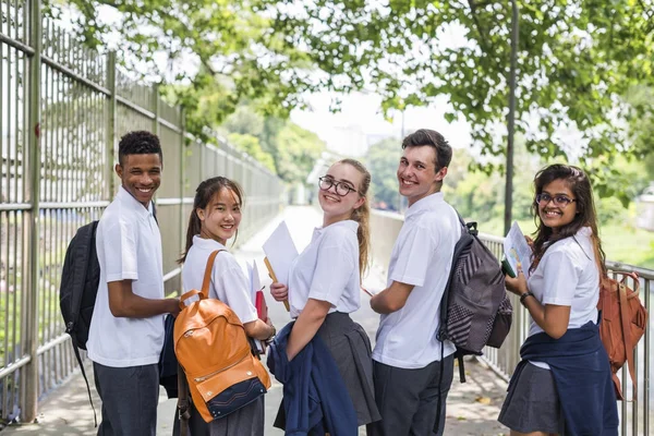 Olika studenter i College Uniform — Stockfoto