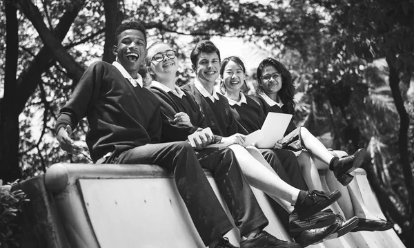 Olika studenter i College Uniform — Stockfoto