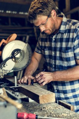 Carpenter Craftman in workshop clipart