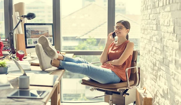 Woman puts feet on table