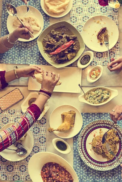 people eating Indian Food in restaurant