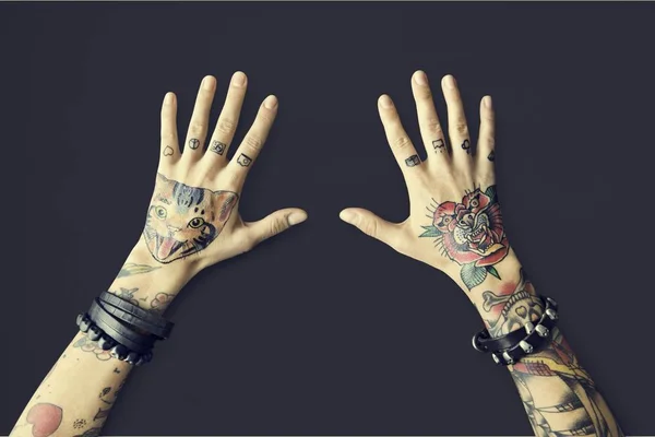 Woman's hands in tattoos — Stock Photo, Image