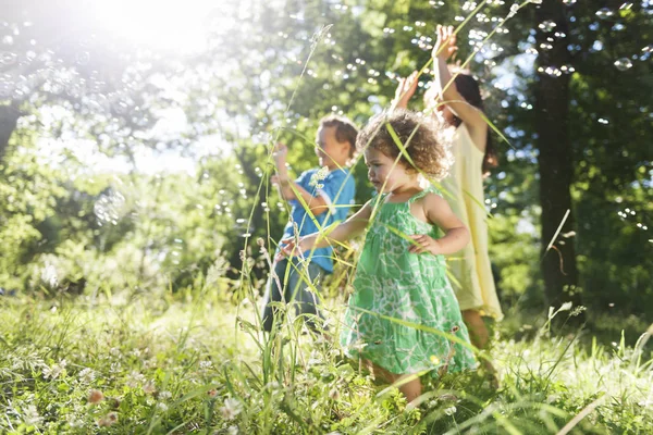 Cute kids playing at park — Stock Photo, Image